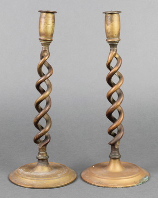 A pair of brass spiral turned candlesticks 12" 
