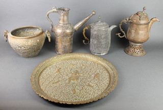 An Indian embossed brass charger 19", brass twin handled jardiniere 7" together with 3 Persian style jugs 13" and 11" 