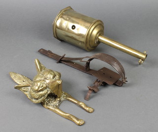 A 19th Century iron gin trap 12", a brass door knocker in the form of a foxes mask 10" and a brass bottle jack 