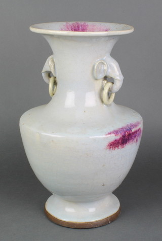 A Chinese pale blue crackle glaze baluster vase with flashes of sang de boeuf having elephant and ring handles 14 1/2"