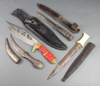 An Eastern dagger with 6" blade, a double bladed dagger with 9 1/2" blade and ivory grip and 2 other knives
