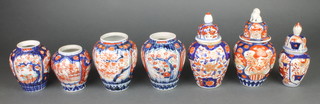 A late 19th Century ribbed baluster Imari vase decorated with trees and flowers 5", 6 others (3 with lids) 