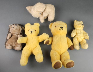A 1960's Wendy Boston yellow bear 12", 2 other yellow bears 13" and 9", a felt figure of a seated elephant and a hand puppet in the form of a hedgehog 8" 