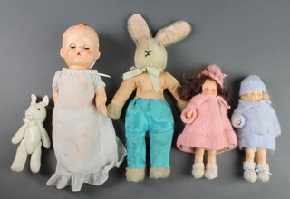 A Pedigree doll with sleep eyes 9", a Rosebud doll 6 1/2", 1 other small doll, miniature cuddly pig and a ditto rabbit, contained in a small case
