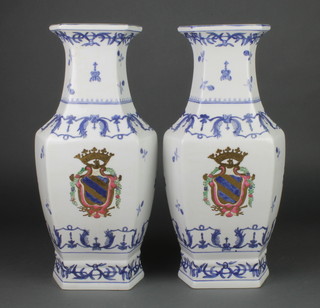 A pair of 20th Century Chinese export style hexagonal blue and white vases decorated with armorials 16 1/2" 