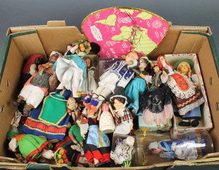 A collection of various costume dolls