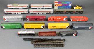 A double headed model of a diesel locomotive and various items of Triang rolling stock 