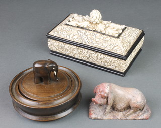 A soapstone carving of a reclining sow 4", a composition box and lid, a hardwood ditto 
