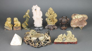 A pair of soapstone figures of seated shi shii 3 1/2", a leaf shaped brush washer decorated with a crab and frog 5 1/2", 4 other soapstone carvings and a carved hardstone figure of Shou Lao 