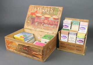 A Cadbury's Dairy Milk wooden box, a Delta shop display box containing various binding, together with various cartons 