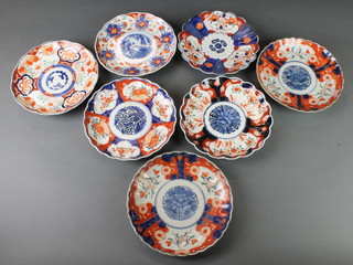 A pair of late 19th Century Imari scalloped dishes with panels of flowers 9" and 5 others