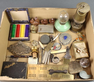A brass cribbage board, a miner's safety lamp and other curios 