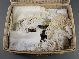 A wicker hamper containing a collection of various lace trim 