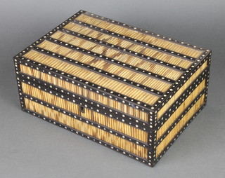 A Ceylonese ebony and porcupine quill box, inlaid with ivory roundels, the interior fitted a compartmented tray, 5"h x 12"w x 8"d 