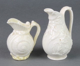 A Belleek moulded jug with mask spout 4" with black mark, a ditto shallow jug 3" with black mark