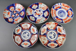 A pair of late 19th Century Imari scalloped dishes with panels of flowers 9" and 3 others