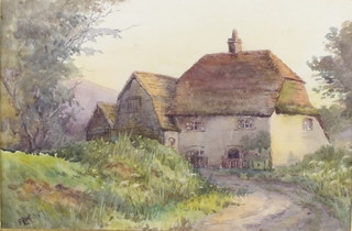 An Edwardian watercolour, monogrammed, study of a country cottage, 6" x 9" 