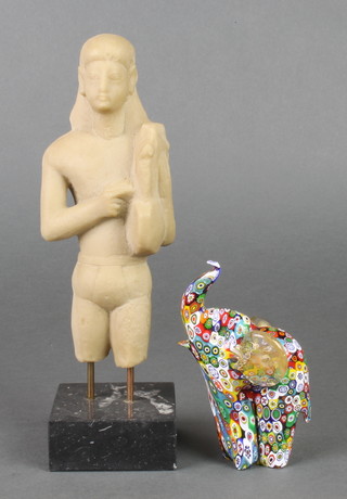 A Millefiori figure of a standing elephant 5", a composition Egyptian figure on a black slate socle 10" 