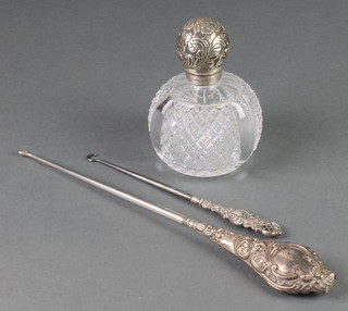 A Victorian cut glass silver mounted scent bottle with floral lid 4 1/2", 2 repousse button hooks