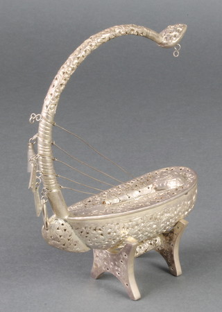 A Persian white metal vessel on stand, 116 grams