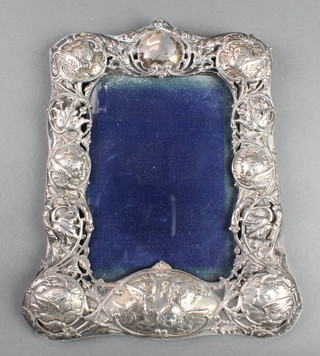 An Edwardian repousse silver photograph frame decorated with Reynolds angels and flowers London 1902 9" x 7" 