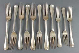 A set of 8 silver dinner forks with chased armorials, 3 ditto dessert forks, London 1926, 175 grams