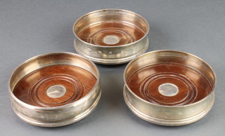 A set of 3 modern silver coasters with inset bases, Sheffield 1977 5" 