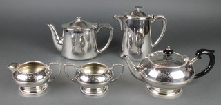 A silver plated 3 piece tea set, 2 plated hotwater jugs 