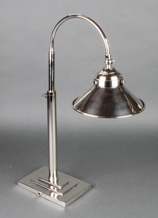A plated telescopic table lamp on a stepped base 
