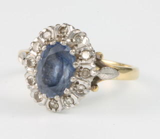 An 18ct yellow gold sapphire and diamond cluster ring size O
