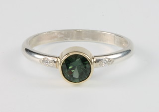 A silver gem set ring set a green sapphire ring in a 9ct gold mount, size O