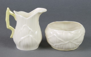 A Belleek moulded jug 3 1/2", a ditto bowl 3 1/2", both brown marks