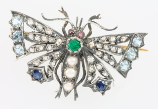 A yellow gold bug brooch in the form of a butterfly set with opals, sapphires, emeralds and diamonds 