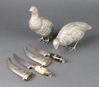 A pair of silver plated figures of grouse 6" and 2 tourist daggers