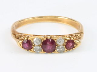 A Victorian 18ct yellow gold diamond and ruby ring, size M 1/2