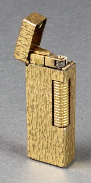 A gentleman's gold plated Dunhill cigarette lighter with bark finish 