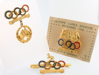 A 1956 Melbourne Olympic Games souvenir badge and 2 others