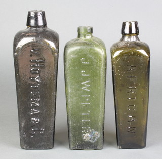A J J W Peters green glass spirit bottle decorated a dog and marked Trade Mark, a green glass tapered spirit bottle stamped African 9" and a green glass spirit bottle marked V. Hoytema & Co 