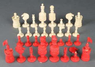 A carved turned and stained ivory chess set, the King 4" 