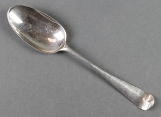 A George III silver dessert spoon with scroll back, 50 grams