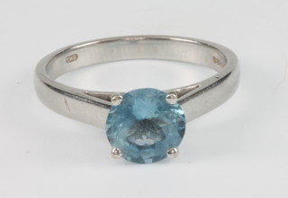 An 18ct white gold brilliant cut aquamarine single stone ring, size Q