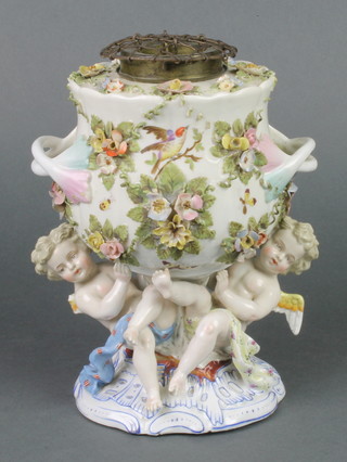 A Dresden porcelain oil lamp base in the form of a twin handled floral encrusted urn, supported by 2 cherubs, the base marked R 8"h 