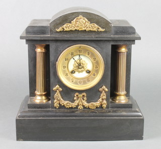 A Victorian French 8 day striking mantel clock with Arabic numerals contained in a black marble architectural case 