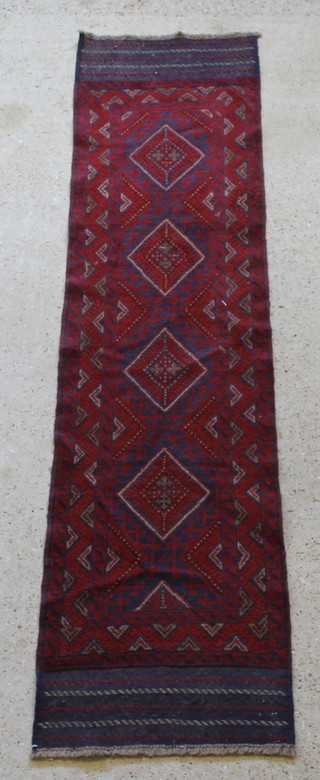 A contemporary Meshwani red and blue ground runner with 4 octagons to the centre 99" x 24" 
