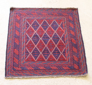 A contemporary Gazak blue and red ground rug with diamond decoration 48" x 44" 
