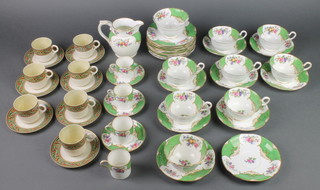 A 36 piece Aynsley Scala pattern tea service comprising cream jug, sugar bowl, 10 tea plates, ?? saucers, 7 large saucers, 4 coffee cans, 3 saucers, together with a 13 piece Belleek coffee service with black mark comprising 7 cups and 6 saucers 