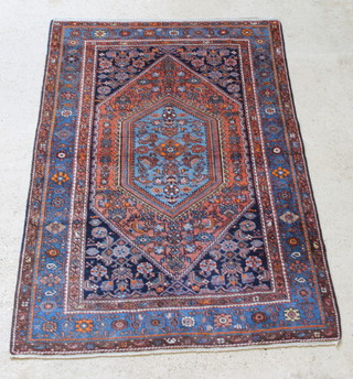 A Persian Nahavand  blue and tan ground rug with diamond shaped medallion to the centre within multi-row borders 79" x 52" 
