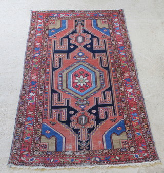 A Bakhtiari  red and blue ground rug, in wear 78" x 44" 

