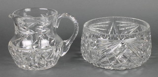 A cut glass water jug 6" and a circular cut glass bowl 8" 
