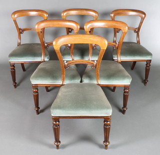 A set of 6 Victorian mahogany bar back dining chairs with shaped mid rails and over stuffed seats, raised on turned and reeded supports, 2 marked Gillow